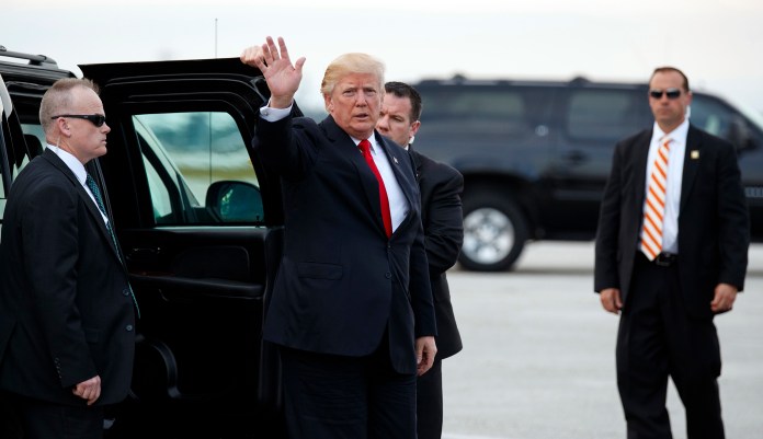 "Does he believe the entire Justice Department and its more than 100,000 employees are part of this deep state?" a reporter asked Sarah Sanders. (AP Photo/Evan Vucci)