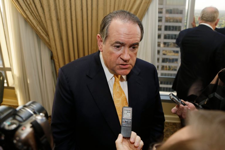 Former Arkansas Gov. Mike Huckabee is interviewed after speaking at a meeting of the Political Animals Club in Little Rock, Ark., on Oct. 25. (AP Photo/Danny Johnston)