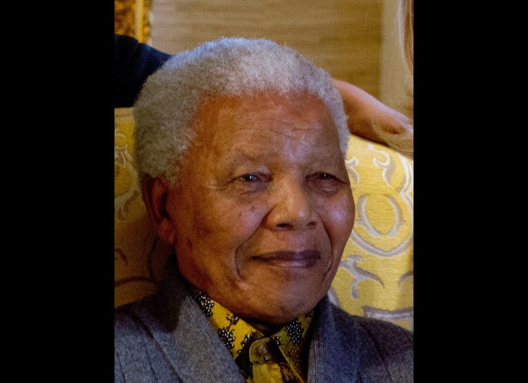   FILE - This photo taken Monday Aug. 6, 2012 shows former South African President Nelson Mandela when he met with US Secretary of State Hillary Rodham Clinton, unseen, at his home in Qunu, South Africa. Mandela on Friday, Dec 14 2012 entered the seventh day of a hospital stay for a lung infection as questions grow about where he is receiving treatment. The 94-year-old patriarch of South Africa's democracy has been hospitalized since Saturday, first undergoing tests and later being diagnosed with the ailment. (AP Photo/Jacquelyn Martin, Pool, File)  