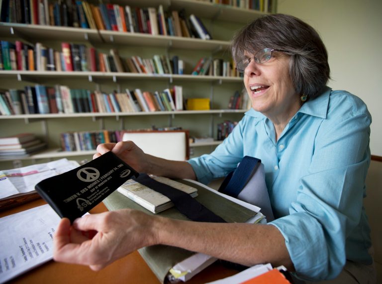   In this photo taken Tuesday, Aug. 27, 2013, Mary Beth Tinker, 61, shows one of her collection of arm bands during an interview with the Associated Press in Washington. Tinker was 13 years old in 1965 when she wore a black armband to school to protest the Vietnam War. School officials suspended her, leading to a lawsuit that went to the U.S. Supreme Court. Now, almost 50 years later, Tinker has resigned her job as a nurse to spend six months traveling around the country to colleges and high schools to talk about free speech. (AP Photo/Manuel Balce Ceneta)  