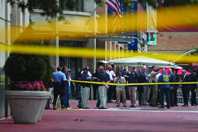 Local and federal investigators work to gather evidence after a security guard was shot in the arm at the headquarters of the Family Research Council Wednesday. (Photo by Chip Somodevilla/Getty Images)