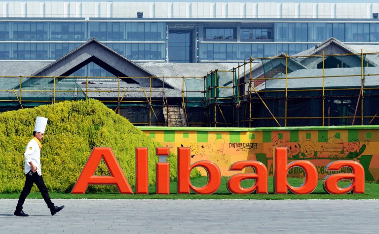FILE - In this Aug. 27, 2014 file photo, a chef walks in the headquarter campus of Alibaba Group in Hangzhou in eastern China's Zhejiang province. Control over Alibaba Group will stay in the hands of founder Jack Ma and other company veterans after the Chinese e-commerce giant goes public on the New York Stock Exchange in a record busting share sale. (AP Photo/File) CHINA OUT