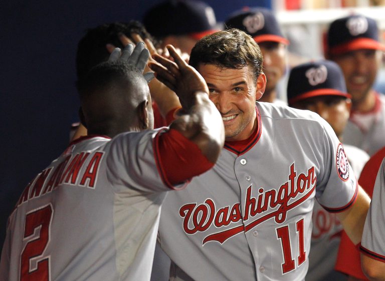 Washington Nationals' Roger Bemadina (2) celebrates with Ryan Zimmeran (11) after Zimmerman hit a third-inning-two-run home run against the Miami Marlins in a baseball game in Miami, Friday, July 13, 2012. (AP Photo/J Pat Carter)