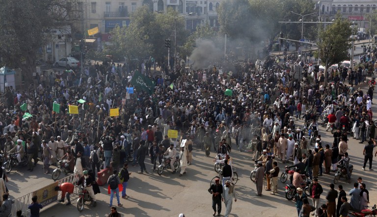 Supporters of religious groups burn tires at a rally to express solidarity with protesters block main highway in Peshawar, Pakistan. (AP Photo/K.M. Chaudary)