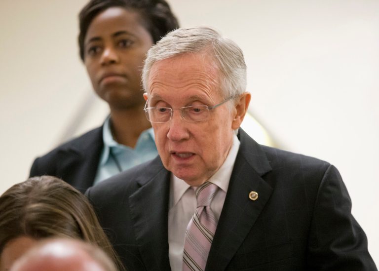   Senate Majority Leader Harry Reid of Nev. walks to a closed-door briefing by national security officials on the situation in Syria, Friday, Sept. 6, 2013, on Capitol Hill in Washington. President Barack Obama has requested congressional authorization for military intervention in Syria in response to last month's alleged sarin gas attack in the Syrian civil war. (AP Photo/J. Scott Applewhite)  