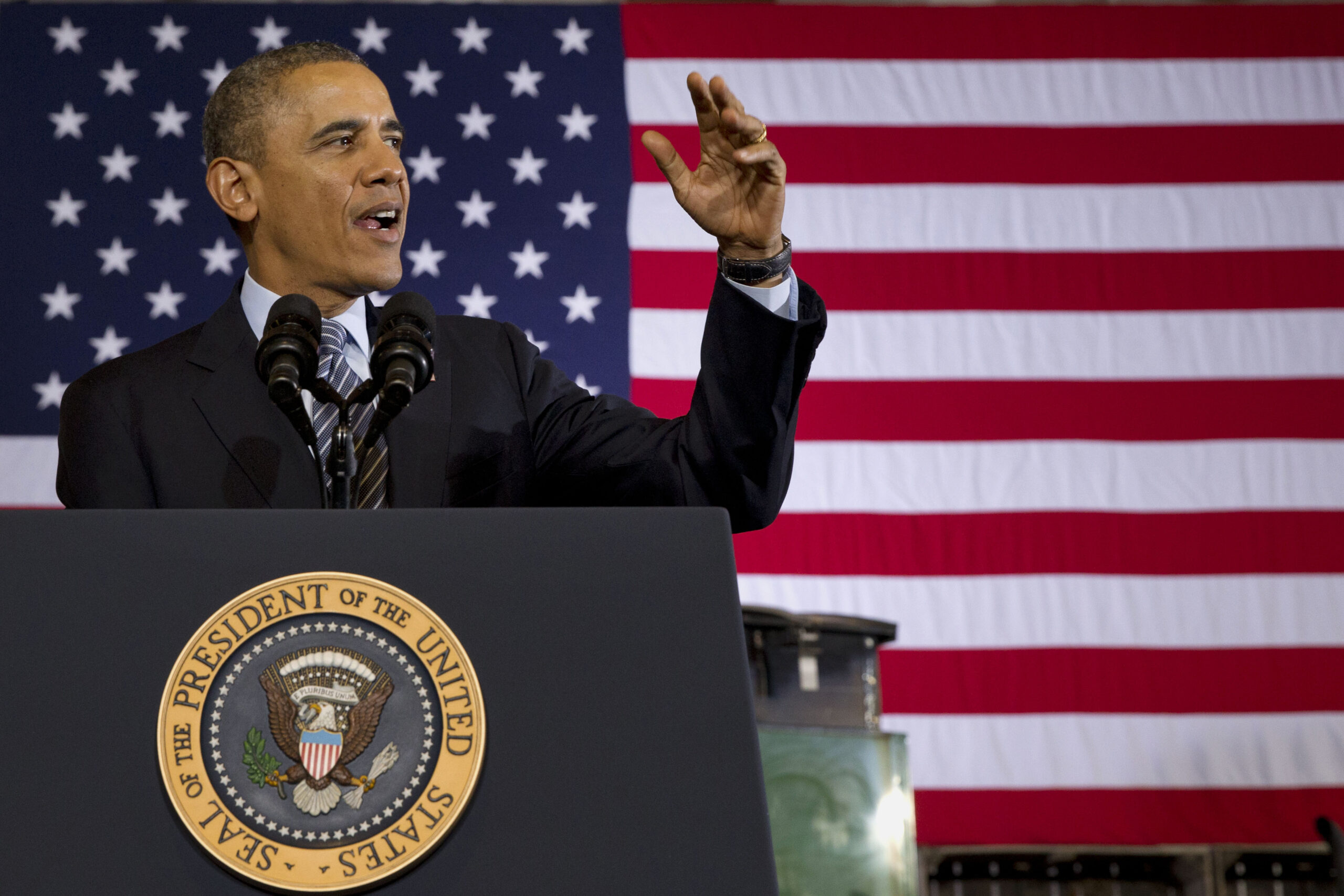 Obama signs farm bill that trims food stamps
