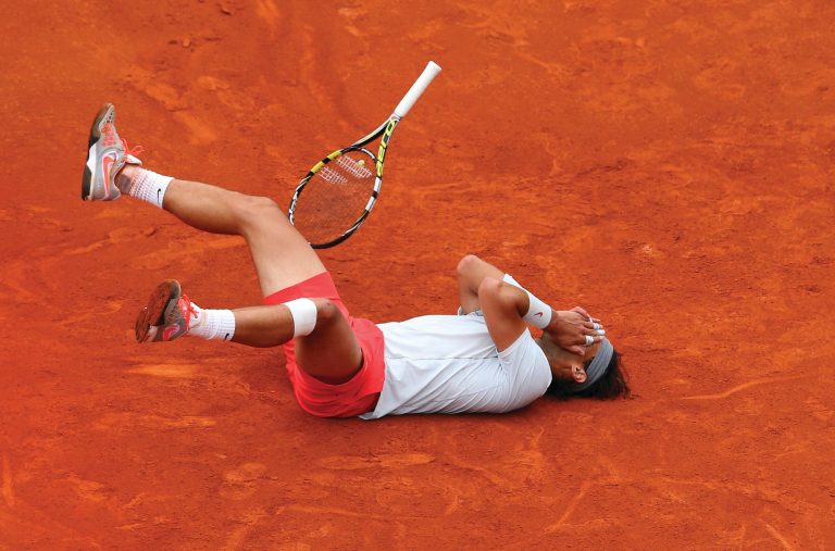 Julian Finney/Getty Images
Rafael Nadal celebrates after defeating David Ferrer on Sunday in the French Open final, setting a record with his eighth championship at Roland Garros.