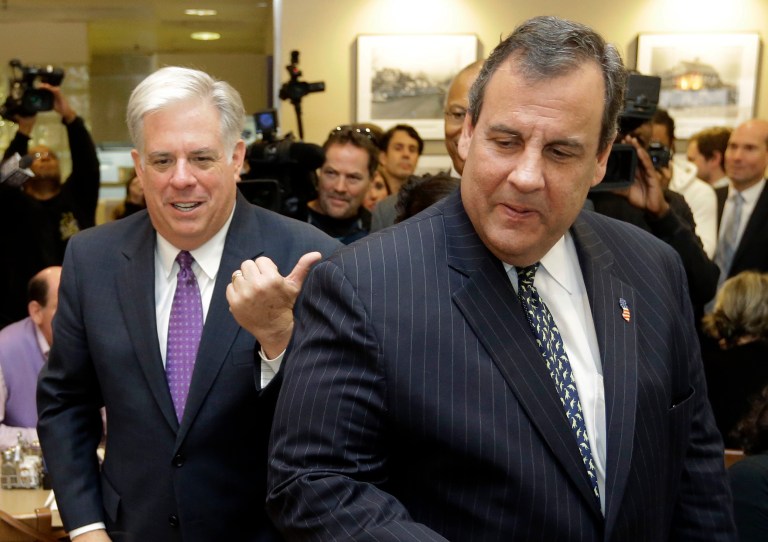 Larry Hogan, left, Republican candidate for Maryland governor, points to New Jersey Gov. Chris Christie as they greet diners at The Original Pancake House in Bethesda, Md., Tuesday, Oct. 21, 2014. 