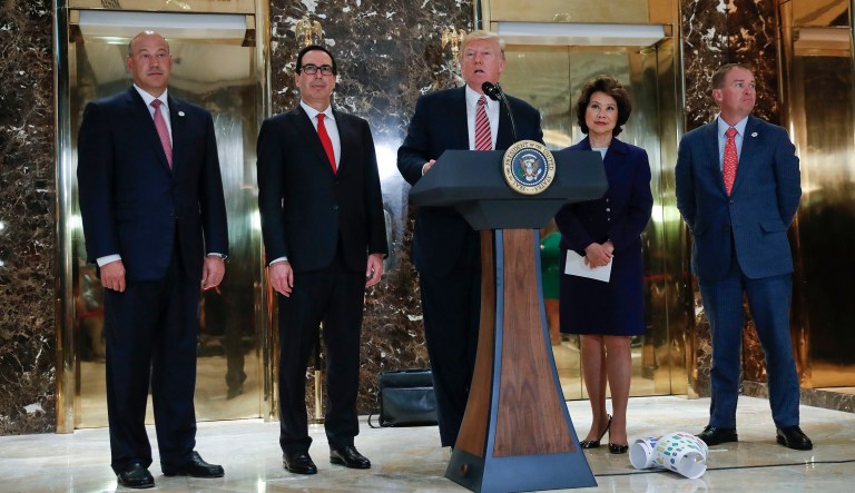 President Trump speaks to the media in the lobby of Trump Tower. With Trump are National Economic Council Director Gary Cohn, Treasury Secretary Steven Mnuchin, Transportation Secretary Elaine Chao and OMB Director Mick Mulvaney. (AP Photo/Pablo Martinez Monsivais)