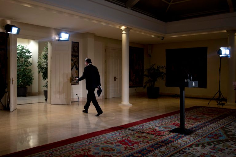   Spain's Prime Minister Mariano Rajoy walks away after making a speech at the Moncloa Palace in Madrid, Friday Dec. 28, 2012. In his end of year assessment, Mariano Rajoy said Friday the crisis had been worse than he had anticipated and that the first half of 2013 will be very hard, but that the economy should begin to recover in the second semester. Rajoy says the country's economy will be in recession for some time and faces a tough year ahead as it grapples with a deep financial crisis and 25 percent unemployment. (AP Photo/Paul White)  