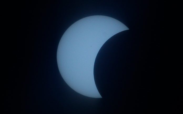 The total eclipse of the sun Monday is expected to prompt fossil fuel generators to ramp up quickly to fill in the gaps as solar power goes dark from Oregon to the Carolinas. (AP Photo/Aaron Favila)