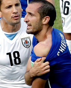 Soccer’s bad boy bites opponent at World Cup