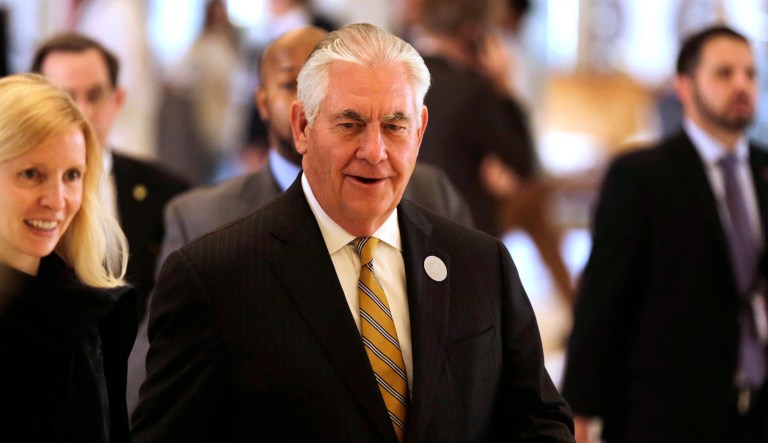 Secretary of State Rex Tillerson, center, walks in the Royal Court Palace, Sunday, May 21, 2017, in Riyadh, Saudi Arabia. (AP Photo/Hasan Jamali)