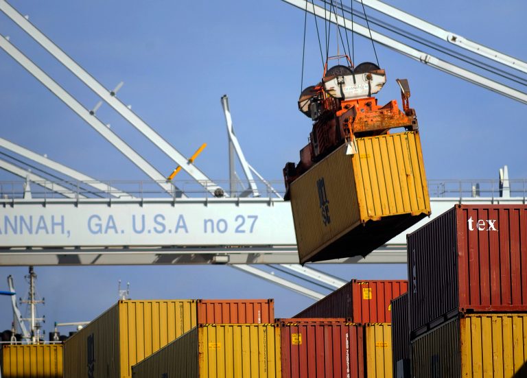 In this Monday, Jan. 27, 2014, photo, a ship to shore crane unloads a shipping container at the Georgia Ports Authority Garden City terminal, in Savannah, Ga. The Commerce Department reports on the U.S. trade deficit for December on Thursday, Feb. 6, 2014. (AP Photo/Stephen B. Morton)