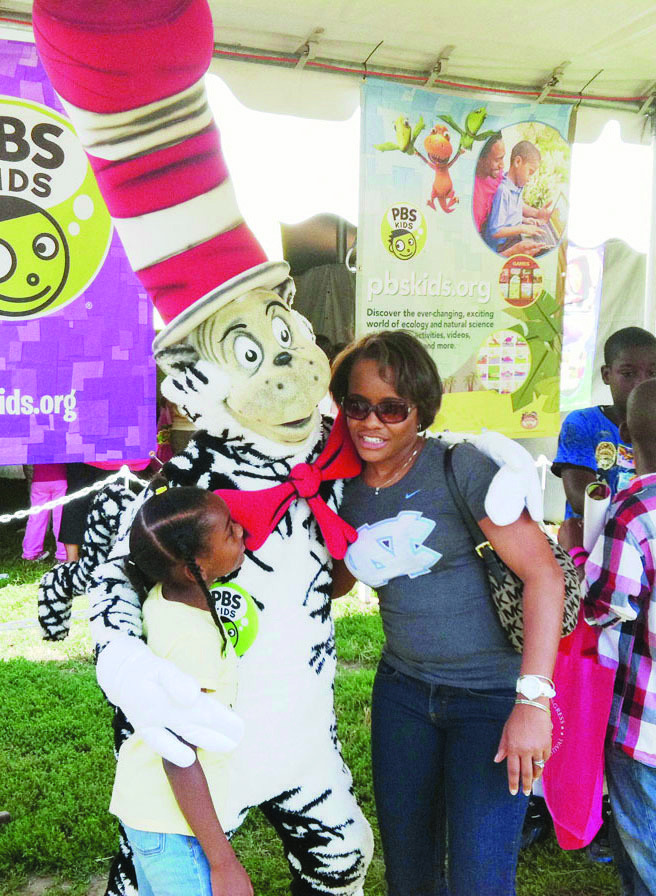 Jayda Owens, 7, and her mother Tomeka Owens pose with Dr. Suess' The Cat in the Hat at the National Book Festival. Ben Giles/Examiner