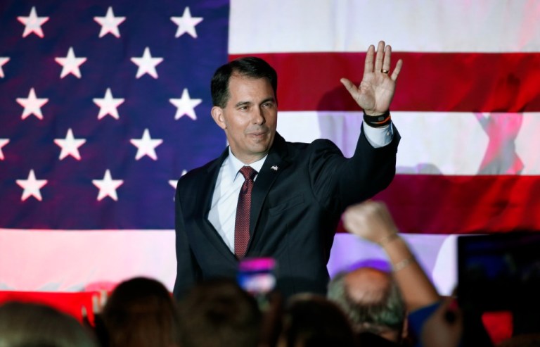 Some of the members who left the conference said they were not sure why Scott Walker was invited, but they appreciated the visit. (AP Photo)