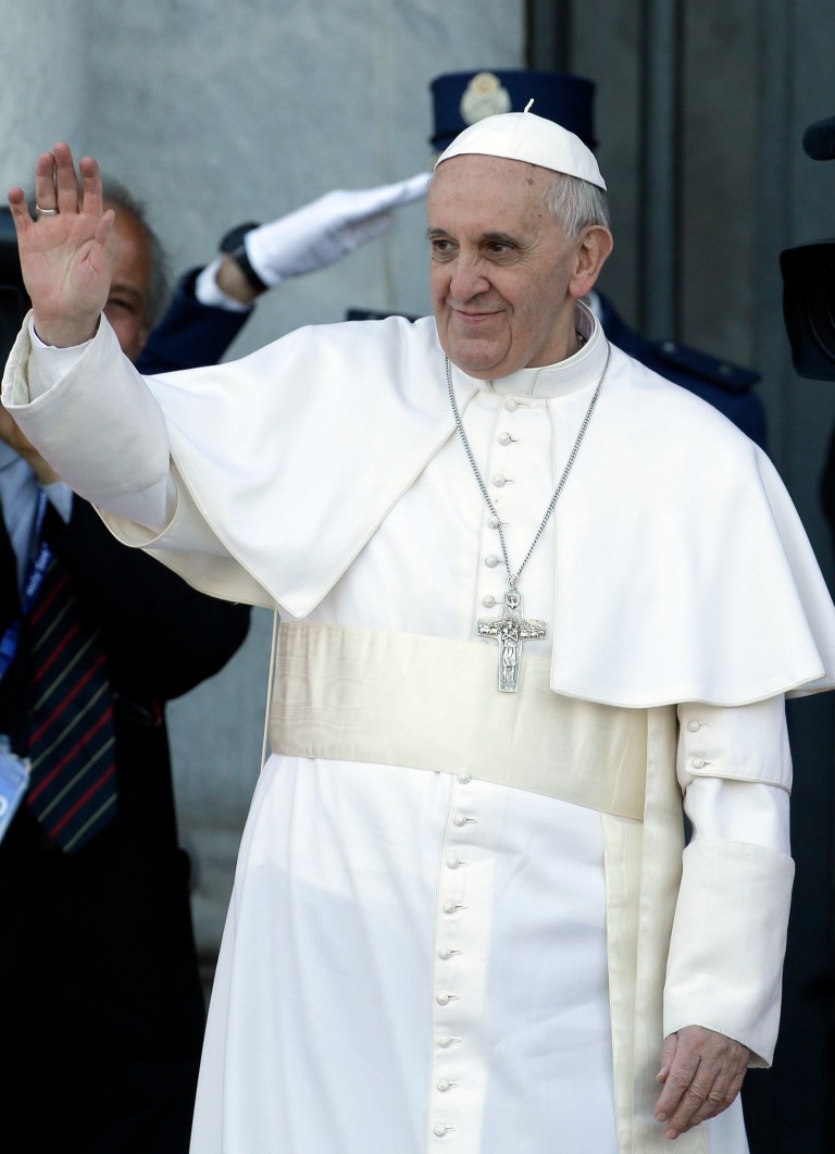 FILE - In this April 7, 2013 file photo Pope Francis waves to faithful upon his arrival for his installation Mass at the St. John in Lateran Basilica, in Rome. Pope Francis has named nine cardinals to advise him on running the church and reforming the Vatican bureaucracy. The Vatican announced Saturday, April 13, 2013 the members of the advisory panel and said they would hold their first meeting Oct. 1-3. They include current Vatican officials but more importantly cardinals from Europe, the Americas, Australia and Asia. (AP Photo/Gregorio Borgia,File)