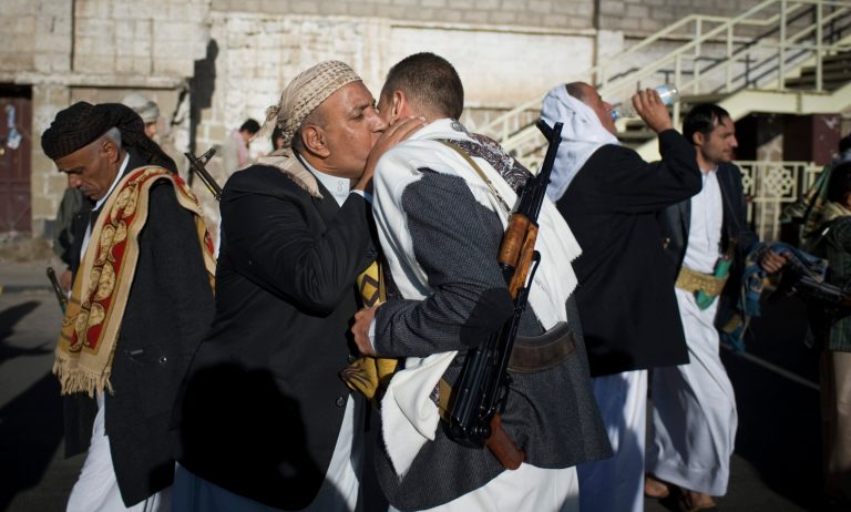 Yemenis exchange greetings after Eid al-Adha prayers attended by supporters Houthis Shiite rebels in the first day of the Muslim holiday of Eid al-Adha in Sanaa, Yemen, Saturday, Oct. 4, 2014. Muslims around the world celebrated Eid al-Adha Saturday to commemorate the willingness of the prophet Ibrahim - or Abraham as he is known in the Bible - to sacrifice his son in accordance with God's will, though in the end God provides him a sheep to sacrifice instead. The major Muslim holiday coincides this year with the Jewish holiday of Yom Kippur, the first time this has happened since 1981. (AP Photo/Hani Mohammed)