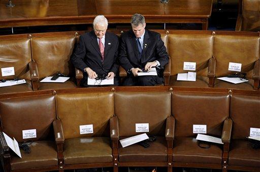 Sen. Orrin Hatch, R-Utah, left, and Sen. Scott Brown, R-Mass., wait on Capitol Hill in Washington, Thursday, Oct. 13,2011. Hatch and Rep. Tim Scott, R-S.C. (not pictured) recently introduced the Employee Rights Act.