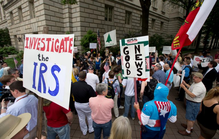 Tea Party supporters gather for a rally outside the Internal Revenue Service headquarters in Washington in May 2013. (AP Photo/Manuel Balce Ceneta)