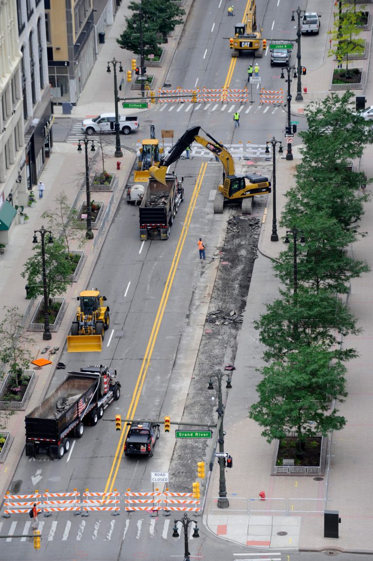 A llong-awaited commuter light rail project begins on Woodward Avenue in Detroit on Monday, July 28, 2014. A large portion of Woodward Avenue was closed off Monday morning while workers began cutting concrete. Work on the $137 million, 3.3-mile line project, which is expected to take two years and stretch from downtown to New Center, will at times shut down parts of Woodward and two interstate bridges. (AP Photo/Detroit News, David Coates)  DETROIT FREE PRESS OUT; HUFFINGTON POST OUT   MBO  (REV-SHARE)