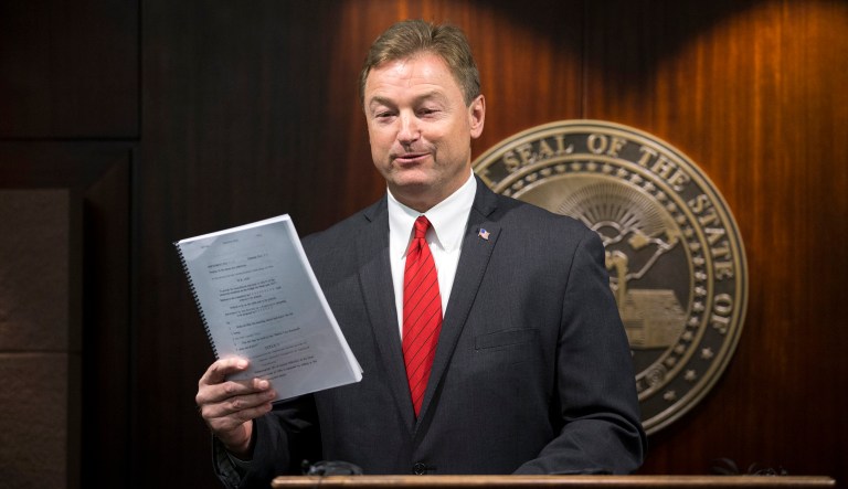 A threatening note taped to Nevada Sen. Dean Heller's campaign office said the writer would lose his insurance if the Republican lawmaker voted for a Senate health bill and the writer would kill the senator, according to a report. (Erik Verduzco/Las Vegas Review-Journal via AP)