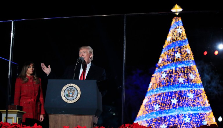 President Donald Trump speaks as first lady Melania Trump listens during the lighting ceremony for the 2017 National Christmas Tree on the Ellipse near the White House in Washington, Thursday, Nov. 30, 2017. (AP Photo/Manuel Balce Ceneta)