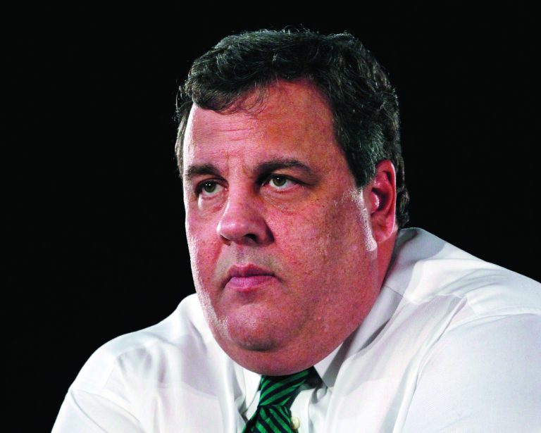 FILE - This Dec. 20, 2012 file photo shows New Jersey Gov. Chris Christie listens to a question in Belmar, N.J. Florida Gov. Rick Scott, who made a fortune as a health care executive, long opposed President Barack Obama's remake of the health insurance market. After the Democratic president won re-election, the Republican governor softened his tone. In New Jersey, Gov. Chris Christie also has walked a careful line. Both Republican governors face re-election in states that Obama won twice, Christie in 2013 and Scott in 2014. (AP Photo/Mel Evans, File)