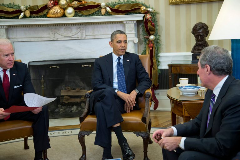 President Barack Obama and Vice President Joe Biden meet with U.S. Trade Representative Michael Froman in the Oval Office of the White House in Washington, Monday, Dec. 16, 2013. (AP Photo/ Evan Vucci)