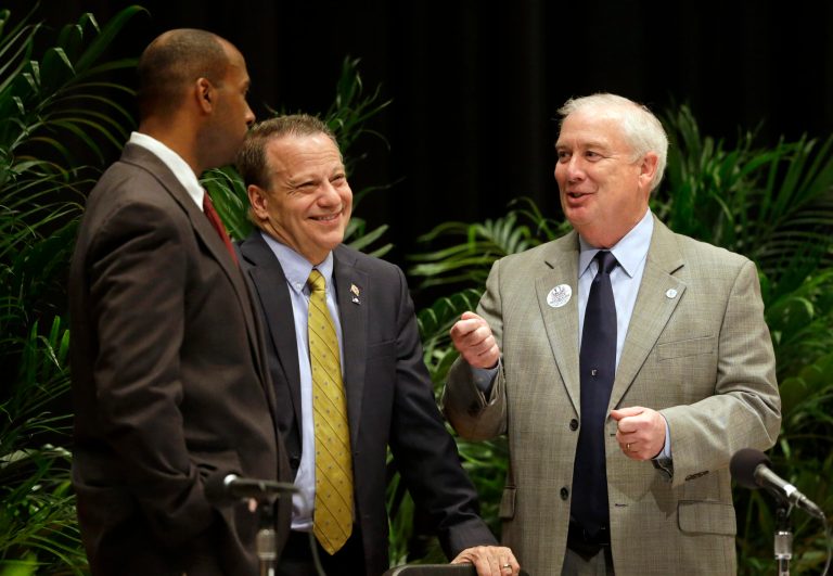 Candidates Charles Lollar, from left, Ron George and David Craig chat before participating in a debate for Republican gubernatorial candidates at Johns Hopkins University in Baltimore, Thursday, April 10, 2014. The candidates are competing for a chance to succeed Democratic Gov. Martin O'Malley, who is unable to run for re-election due to term limits. (AP Photo/Patrick Semansky)