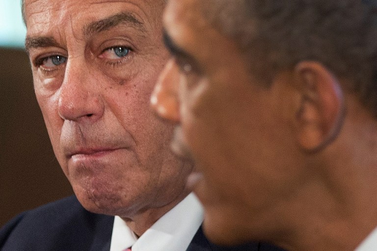   House Speaker John Boehner of Ohio listens as President Barack Obama speaks to media, in the Cabinet Room of the White House in Washington, Tuesday, Sept. 3, 2013, before a meeting with between the president and Congressional leaders to discuss the situation in Syria. Boehner said he will support the president's call for the U.S. to take action against Syria for alleged chemical weapons use and says his Republican colleagues should support the president, too. (AP Photo/Carolyn Kaster)  