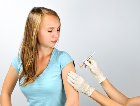 Girl getting flu shot