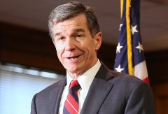North Carolina governor signs bill repealing HB2 bathroom law – despite LGBTQ community criticism
