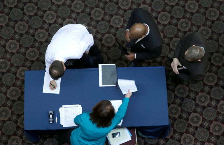 FILE - In this Wednesday, Jan. 22, 2014, file photo, job seekers sign in before meeting prospective employers during a career fair at a hotel in Dallas. The Labor Department releases the  job openings and labor turnover survey for December on Tuesday, Feb. 11, 2014. (AP Photo/LM Otero, File)