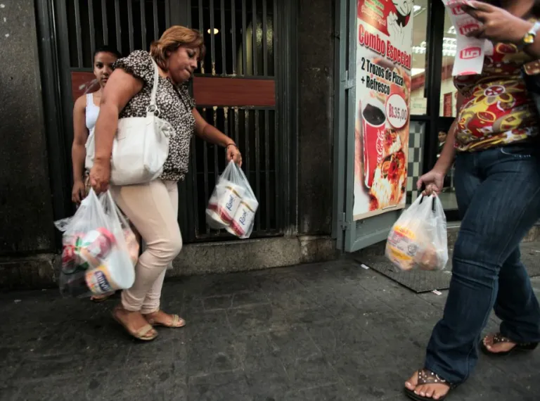 A customer leaves a private super market.