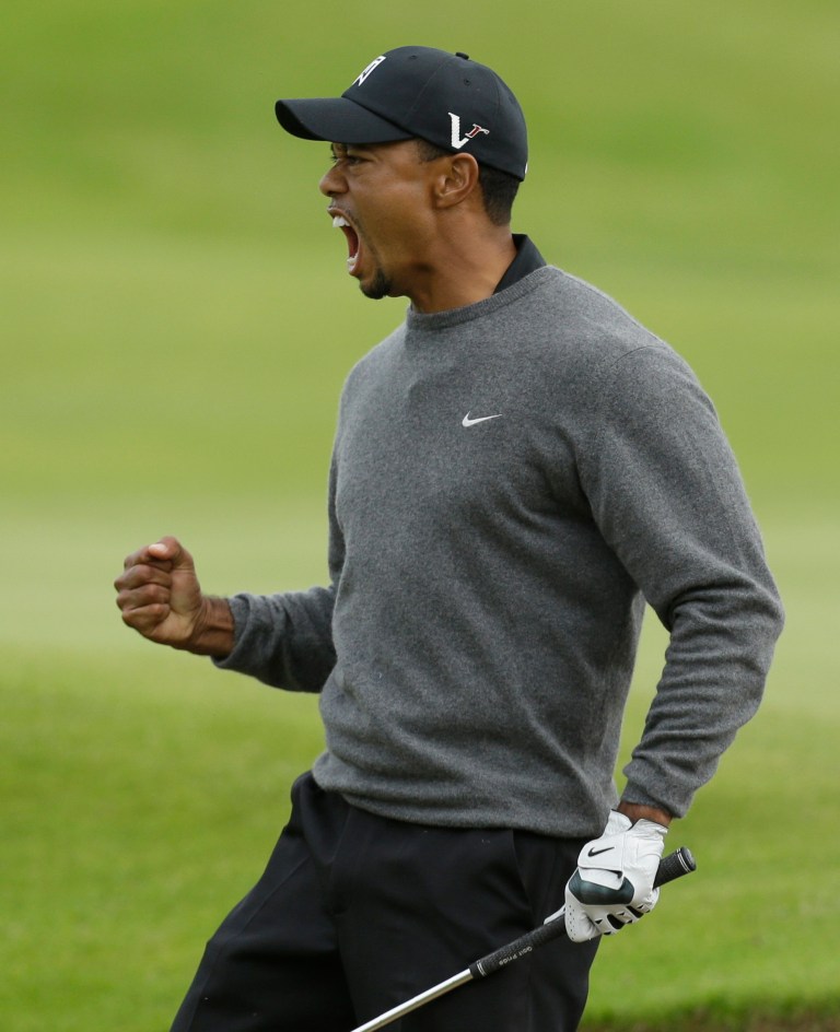 Tiger Woods of the United States reacts after a birdie on the 18th hole at Royal Lytham & St Annes golf club during the second round of the British Open Golf Championship, Lytham St Annes, England, Friday, July 20, 2012. (AP Photo/Jon Super)