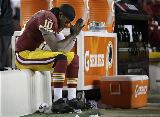 Fans cringe as Skins, RG3 go down hard