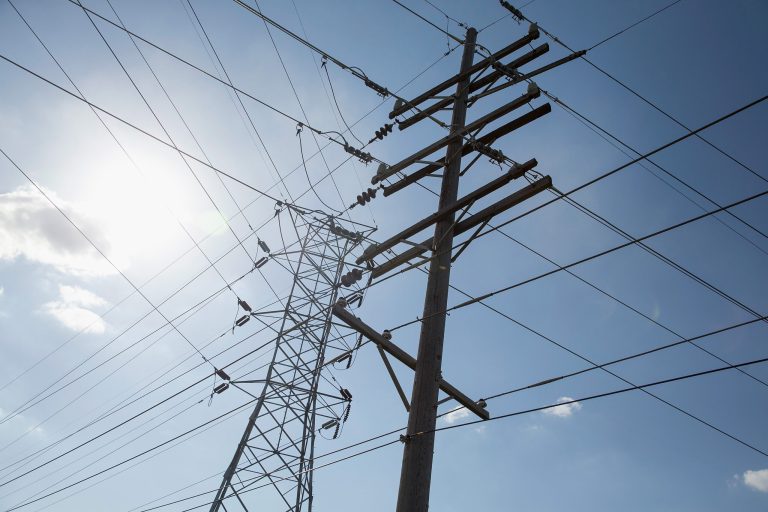 Transmission lines carry electricity from NRG Energy's Joliet Station power plant on May 7, 2015 in Joliet, Illinois. (Photo by Scott Olson/Getty Images)
