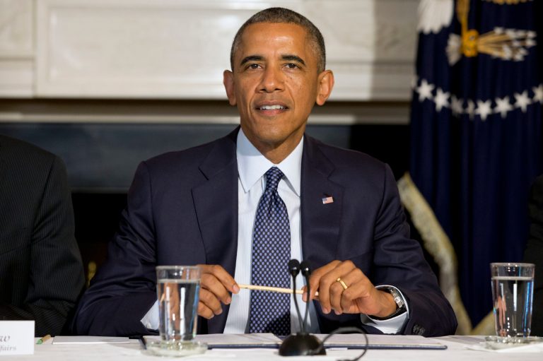 President Barack Obama attends a meeting with state, local, and tribal leaders, Wednesday, July 16, 2014, in the State Dining Room of the White House in Washington, where he spoke about a series of new actions being taken to support communities facing climate change. (AP Photo/Jacquelyn Martin)