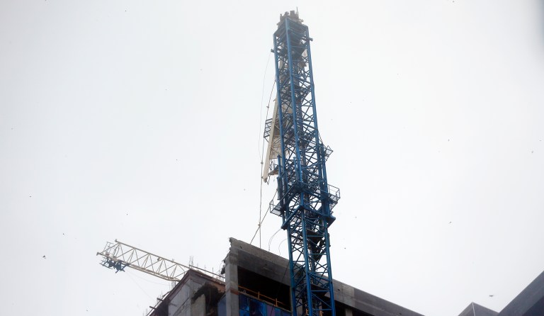 A crane atop a building under construction in downtown is shown after it collapsed as Hurricane Irma passes by, Sunday, Sept. 10, 2017, in Miami. (AP Photo/Wilfredo Lee)