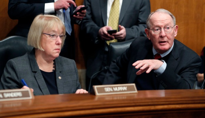 Senate Health, Education, Labor, and Pensions Committee Chairman Sen. Lamar Alexander, R-Tenn., accompanied by the committee's ranking member Sen. Patty Murray, D-Wash. speaks on Capitol Hill in Washington. (AP Photo/Alex Brandon)