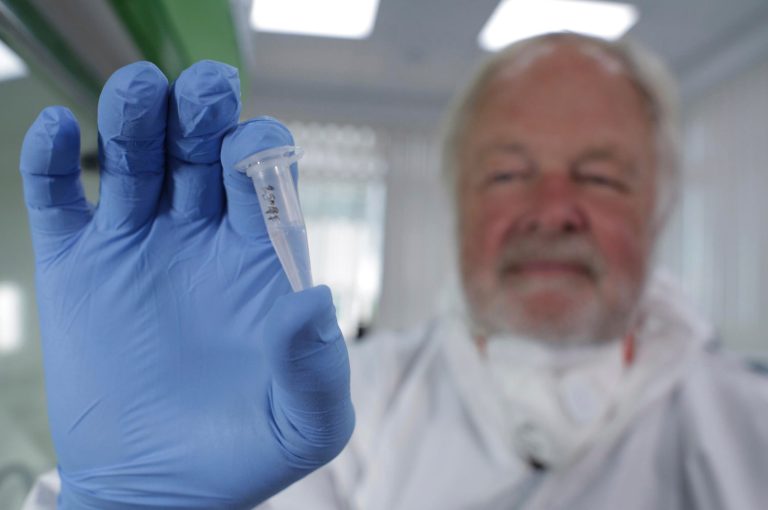 FILE - In this undated photo made available by Britain's Channel 4 television of Oxford University genetics professor Bryan Sykes posing with a prepared DNA sample taken from  hair  from a Himalayan animal.  DNA testing is taking a bite out of the Bigfoot legend. After scientists analyzed more than 30 hair samples reportedly left behind by Bigfoot and other related beasts like Yeti and almasty, they found all of them came from more mundane animals like bears, wolves, cows and raccoons. In 2012, researchers at Oxford University and the Lausanne Museum of Zoology issued an open call asking museums, scientists and Bigfoot aficionados to share any samples they thought were from the mythical ape-like creatures. (AP Photo/ Channel 4)
