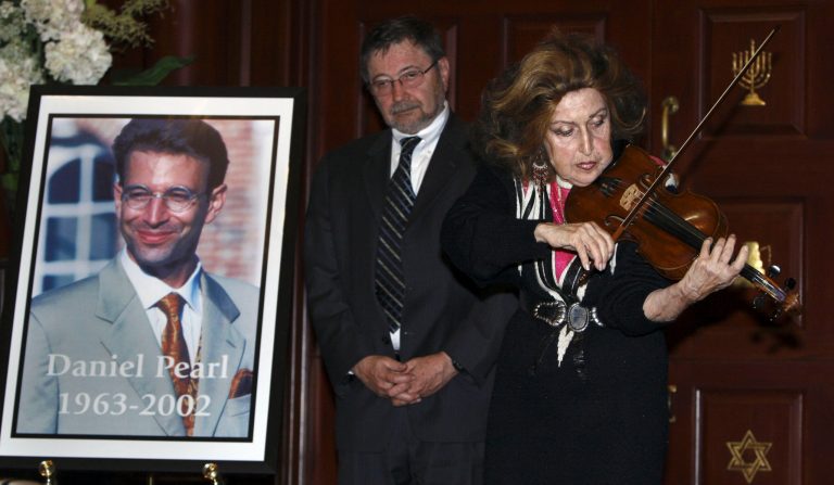 Dr. Judea Pearl, center, father of American journalist Daniel Pearl, who was killed by terrorists in 2002, listens to legendary violinist Ida Haendel Sunday, April 15, 2007, in Miami Beach, Fla. Pearl's son was honored Sunday during a Holocaust memorial ceremony during Yom Hashoah, the annual time of remembrance.