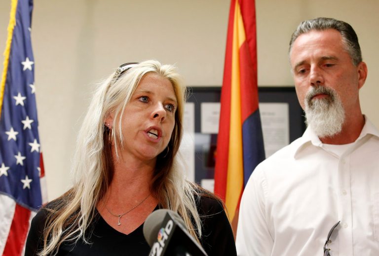 Family members of the victims, Jeanne Brown, left, who had a sister and father murdered, speaks during a news conference as her husband Richard Brown listens, after the nearly two hour long execution of Joseph Rudolph Wood at the state prison on Wednesday, July 23, 2014, in Florence, Ariz. (AP Photo)