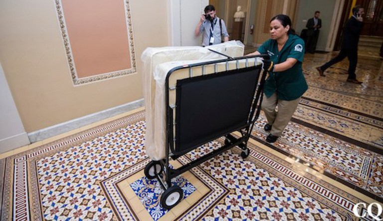 Pictures from Ohio Clock Corridor outside the Senate chamber showed beds being rolled in as part of preparation for the extended vote series that is expected to start late Thursday night and carry on throughout the night. (Image courtesy screenshot)