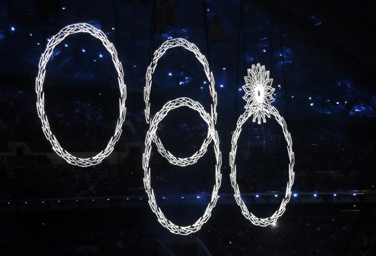 One of the Olympic rings fails to open during a portion of the show where snowflakes were supposed to transition to rings during the opening ceremony of the 2014 Winter Olympics in Sochi, Russia, Friday, Feb. 7, 2014. (AP Photo/Ivan Sekretarev)