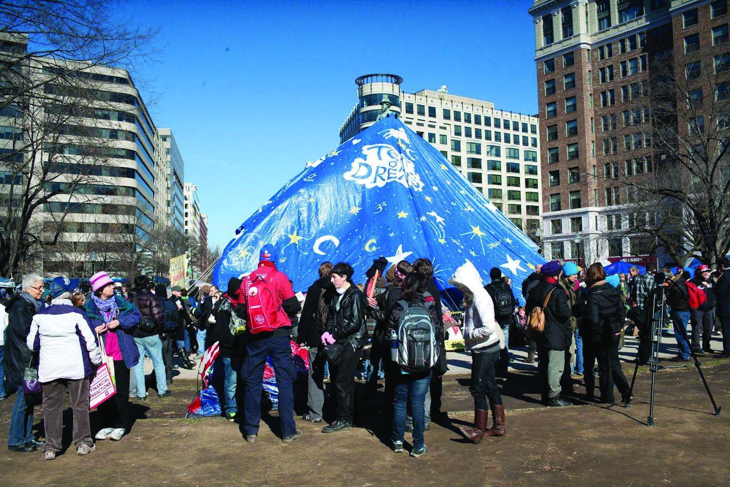 Occupiers hold fast despite park camping ban