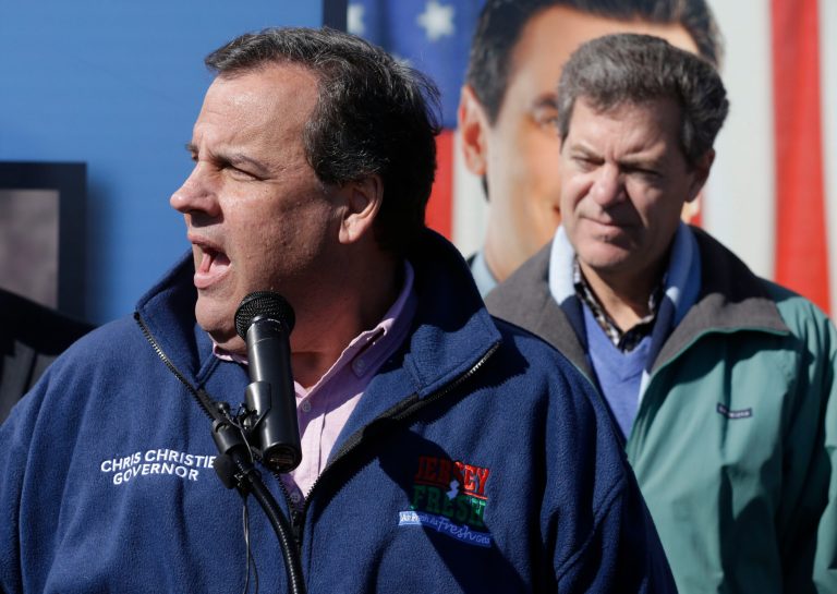 New Jersey Gov. Chris Christie, left, speaks in support of Kansas Gov. Sam Brownback, right, during a campaign stop in Kansas City, Kan., Friday, Oct. 31, 2014. (AP Photo/Orlin Wagner)