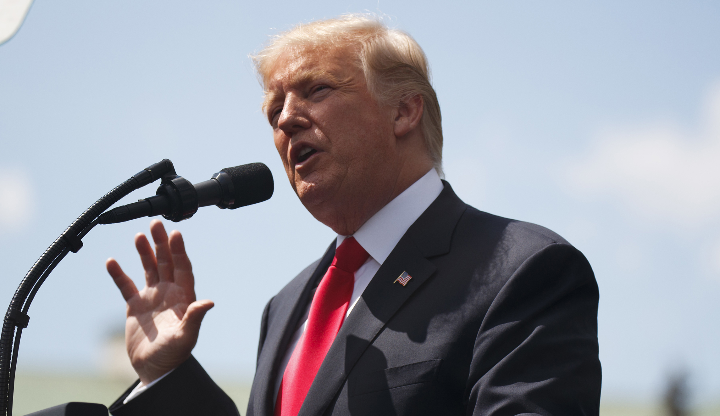 Trump leaves for Paris with Russia troubles brewing at home