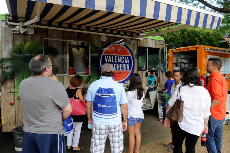 Crowds begin to gather at the Connecticut open tennis tournament in New Haven, Conn., on Saturday, Aug. 23, 2014. Attendance was up at the tournament for the first time since 2005.  (AP Photo/Fred Beckham)